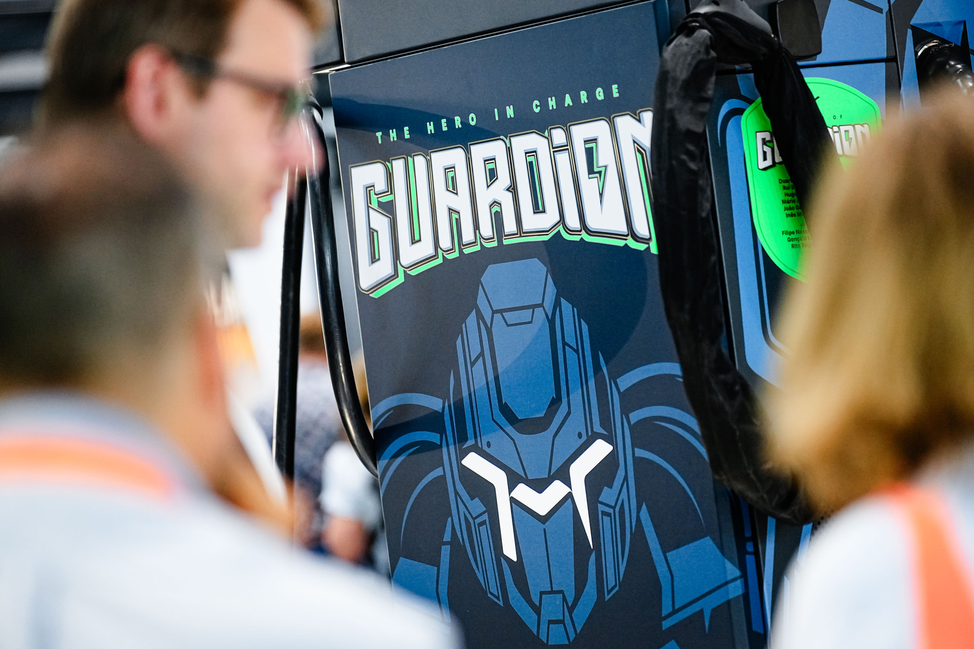 Hellonext team engaging with visitors at the GUARDiON booth